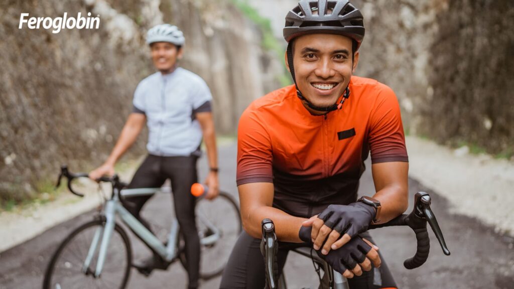 cyclist smiling on road - Vitabiotics India