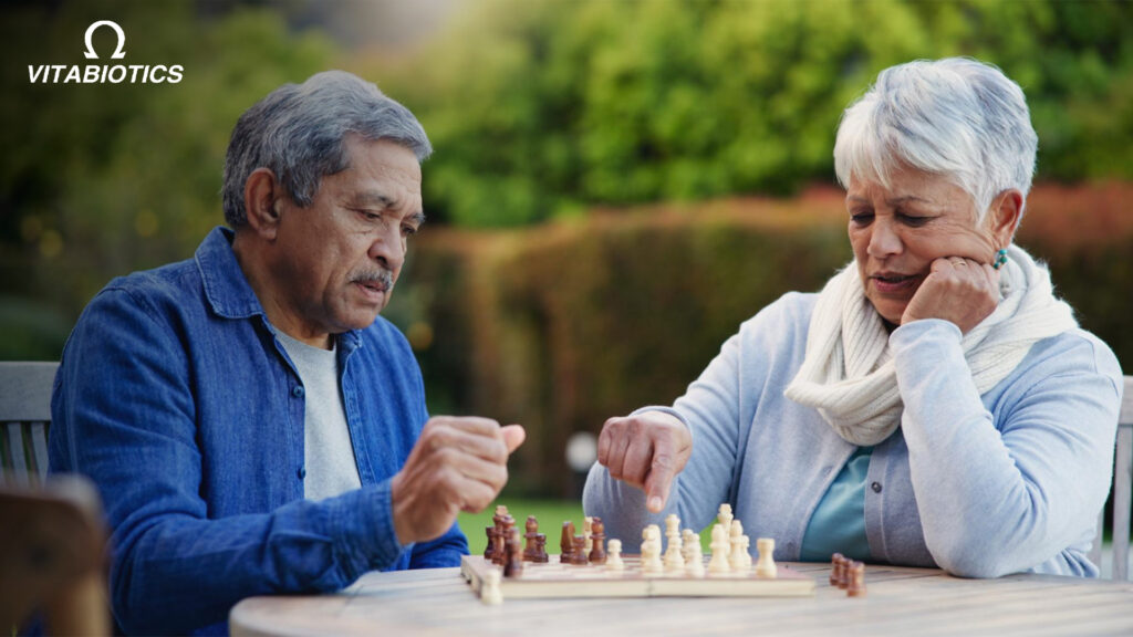 elderly men playing chess promoting senior brain health, mental fitness